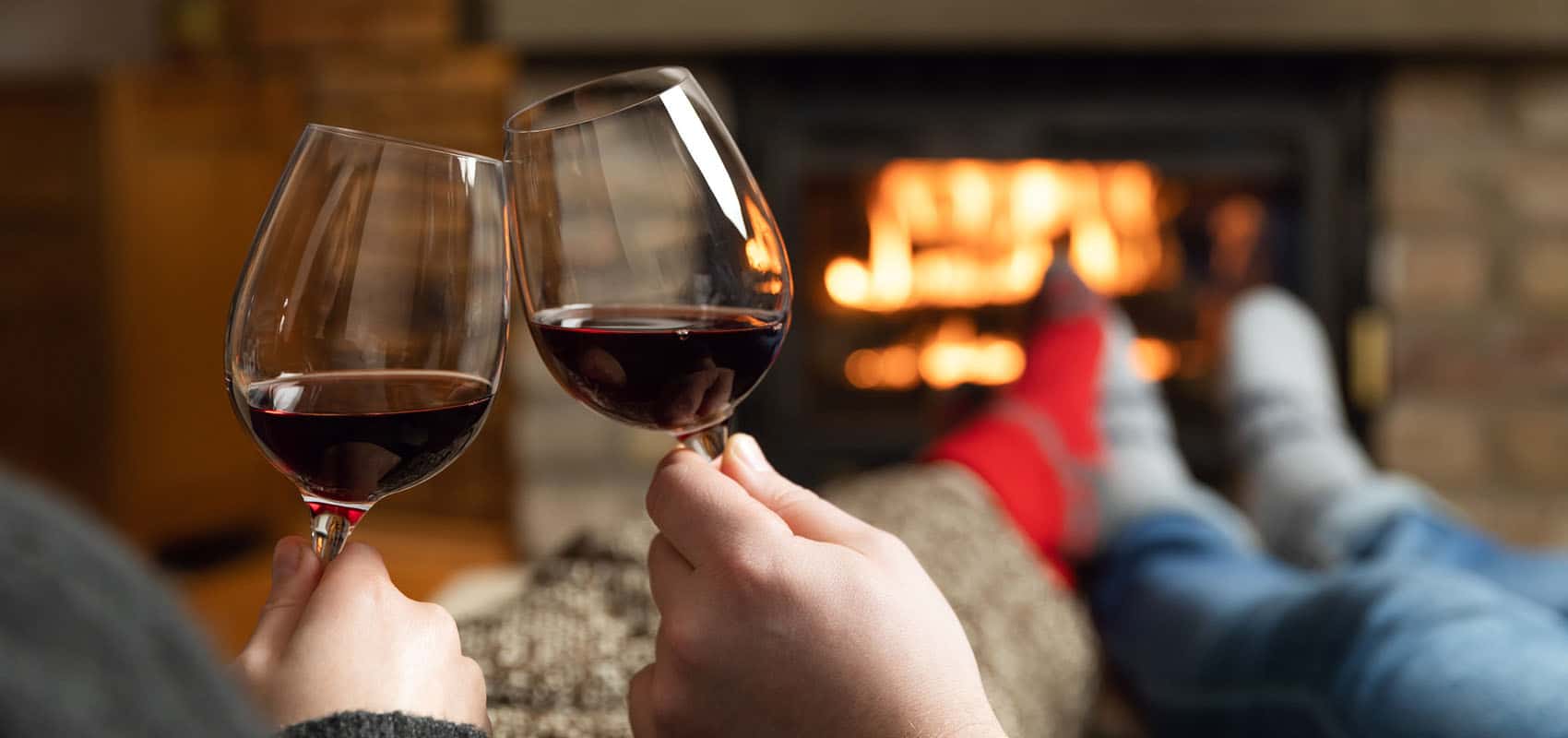 Couple by fire with wine