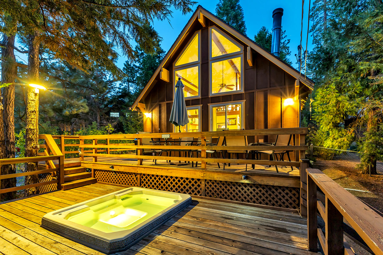 The Ward Cabin at night with hot tub